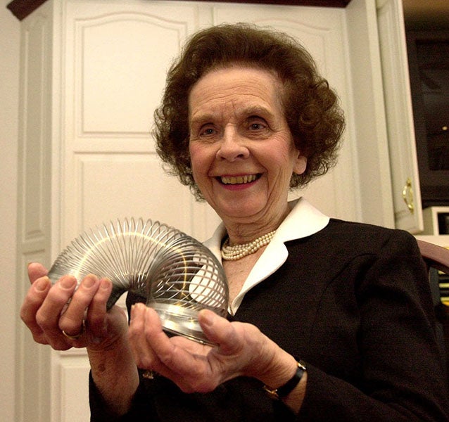 Photograph of Betty James and a Slinky, ca 1990s (whyy.og)