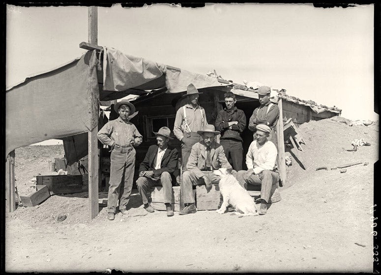 Six AMNH dinosaur bone hunters at Bone Cabin quarry, Wyoming, 1899, including William D. Matthew (seated, far right) and his boss, Henry F. Osborn (seated, center), AMNH neg. no. 17906 (digitalcollections.amnh.org)