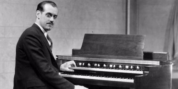 Laurens Hammond seated at a Hammond organ (Ouramericannetwork.org)