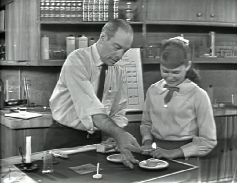 Mr. Wizard (Don Herbert) doing a demonstration with a birthday candle with Rita, “Science in a Candle,” Meet Mr. Wizard, 1964 (youtube.com)