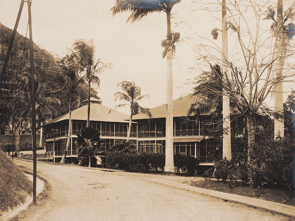 Type 13 two-story house.
The Canal Commission designed a variety of houses for white American employees. A type 13 two-story, single family house had space allotted to servant’s quarters. Two bedrooms and a bathroom were on the second floor. Workers, such as A.B. Nichols, with relatively high salaries would have been allotted a type 13 house. View in Digital Collection »
