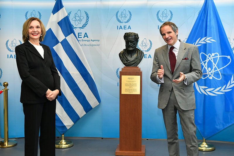 A replica of a bust of Democritus, being donated by the Greek representative (left) to the Director (right) of International Atomic Energy Agency, Vienna, November, 2020 (flickr.com)