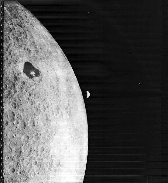 The far side of the Moon, featuring the crater Tsiolkovsky with the peak in the center, and including the Earth rising over the far horizon, photograph taken Aug. 23, 1966, by Lunar Orbiter 1 (nasa.gov)