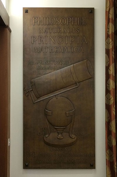 Bronze panel no. 6, based on the title page of Issac Newton’s Principia (1687), with Newton’s reflecting telescope added, cast by Bruno Bearzi, 1967, originally mounted on the south exterior annex wall, now in the auditorium, Linda Hall Library