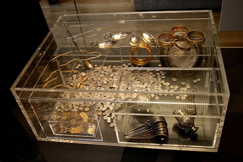 Part of the Hoxne hoard on display; the original oak box, long decayed, is replicated in acrylic (Wikimedia Commons)