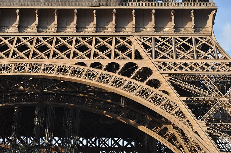 The southwest (Grenelle) side of the Eiffel Tower; the name “Coriolis” is visible in the center of the first level (Phil Beard of flickr)