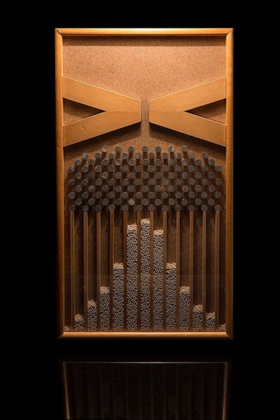 A modern Galton board or box, which can be flipped to generate a normal distribution of falling balls (Wikimedia commons)