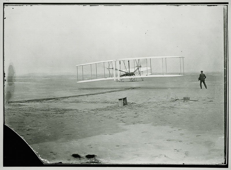 The first flight of Flyer at Kitty Hawk, Dec. 17, 1903, with Orville on the wing and Wilbur on the ground, National Air and Space Museum, Smithsonian Institution (airandspacd.si.edu)