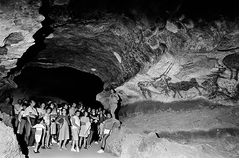 An early tour group at Lascaux, led by Jacques Marsal, one of the boys who discovered the cave on Sep. 12, 1940 (donsmaps.com)
