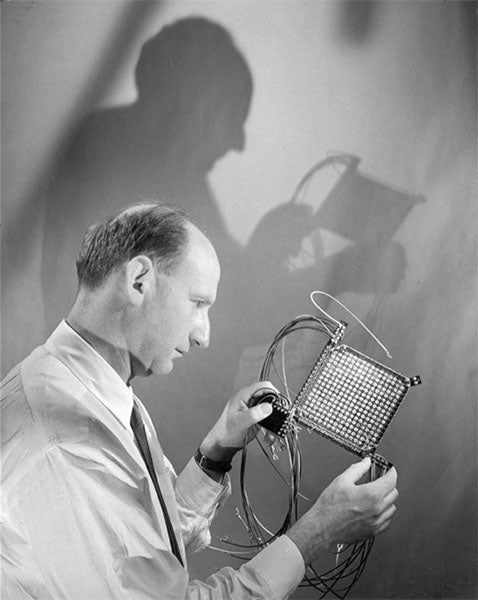 Jan Rajchman holding a 256-bit magnetic core memory array, which he assembled at RCA’s Princeton laboratories in the early 1950s. (David Sarnoff Library Collection, Hagley Museum and Library)