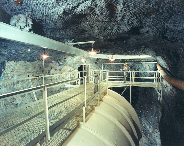 Tetrachloroethylene tank in the Homestake Mine, photograph, 1970s?, with Raymond Davis Jr. at the far end (U.S. Department of Energy on flickr.com)


