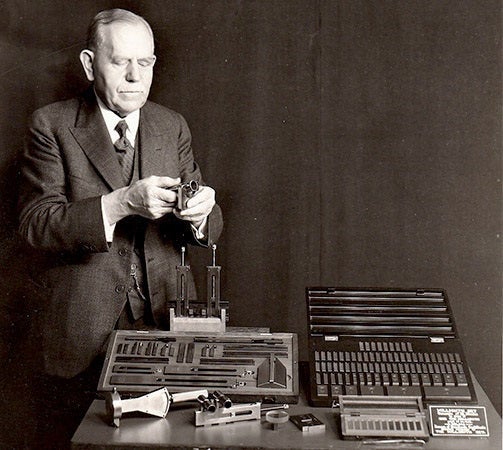 An older Carl Johansson and several sets of his gauge blocks, undated photograph, 1920s? (greatgages.com)
