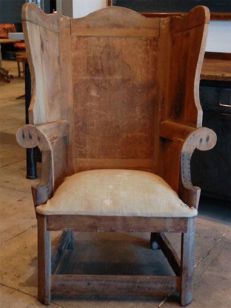 The original reading chair of Nicholas Wing, the ancestor of all modern wingback chairs, now in the Lambeth Museum of Material Culture, London (guardian.com)