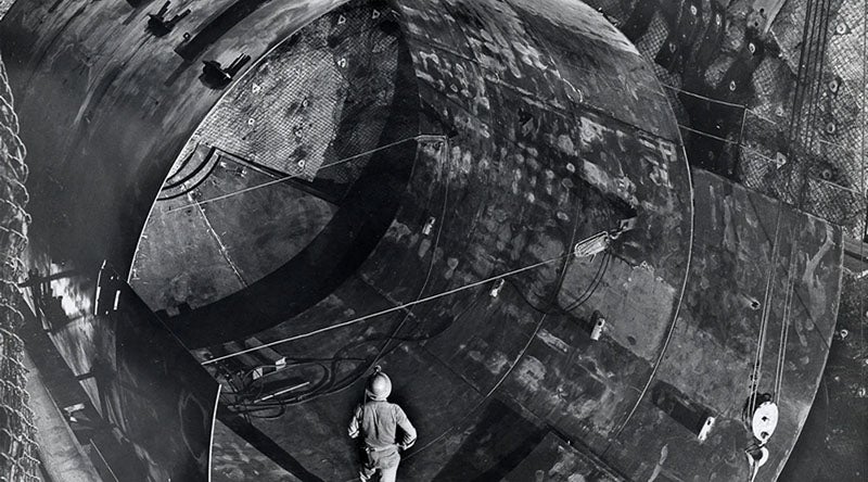 Raymond Davis Jr. observing the construction of the large (390,000 liter) tetrachloroethylene tank at the 4850-foot level of the Homestake Mine, Lead, South Dakota, photograph, ca 1961? (sanfordlab.org)