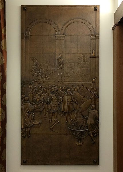 Bronze panel no. 5, based on an engraving by Sebastien Le Clerc of an imagined visit by Louis XIV to the Academie des Sciences in Paris (1676), cast by Bruno Bearzi, 1967, originally mounted on the south exterior annex wall, now in the auditorium, Linda Hall Library