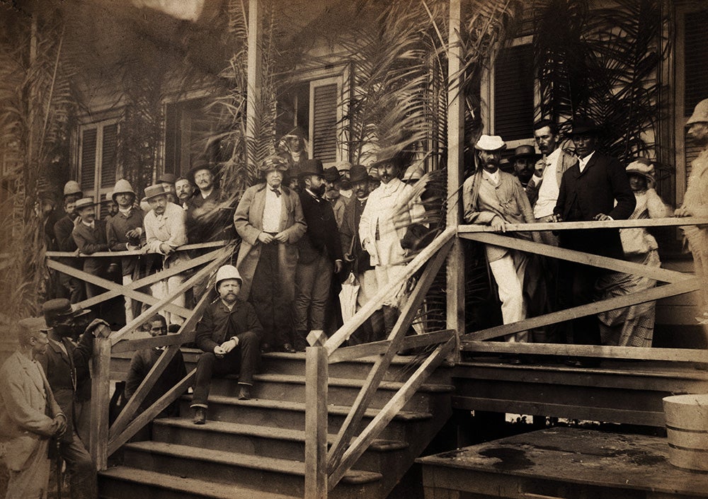 Ferdinand de Lesseps in center, wearing Arab headdress during a visit to Panama in 1886.
The young engineer, Philippe Bunau-Varilla, serving as the acting Director General of the project, was kept close to answer technical questions.  