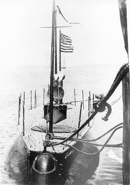 USS Holland (SS-1), tied up at dock, photograph, early 1900s, U.S. Naval History and Heritage Command (history.navy.mil)