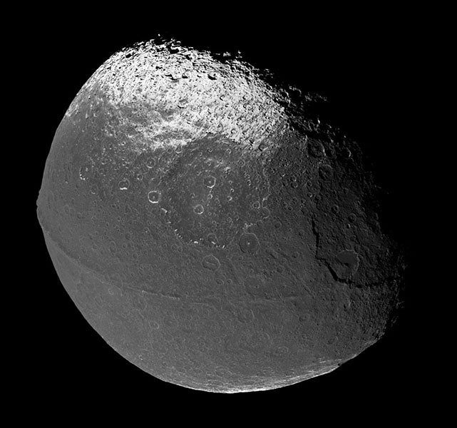Mosaic of photos of Iapetus, taken by Cassini on Dec. 31, 2004; a large section of Iapetus is much darker than the rest, and there is a ridge that runs around most of the equator, NASA (Wikimedia commons)