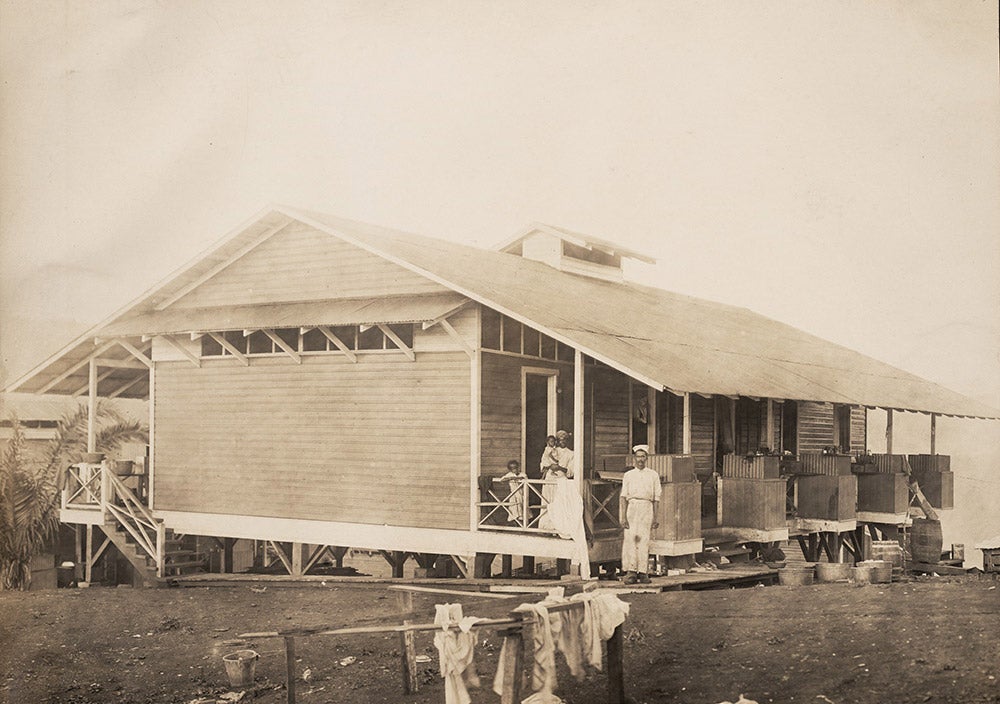 Typical quarters for ten silver roll families.
A silver payroll employee and his family were provided with a 240 square foot apartment with a cooking stove on the veranda. Silver roll wives often had to take on jobs to supplement household income. View in Digital Collection »
