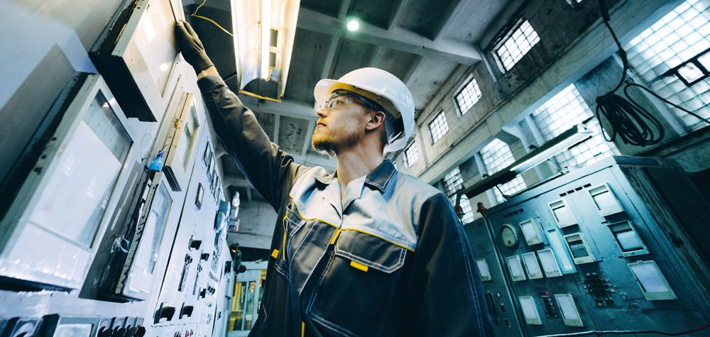 Man doing maintenance at power plant
