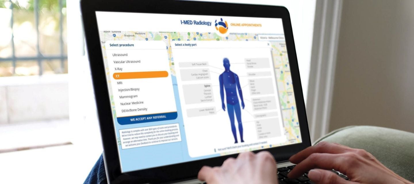 person with laptop booking online