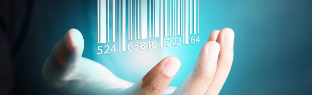 Barcode dropping on businessman hand, financial concept