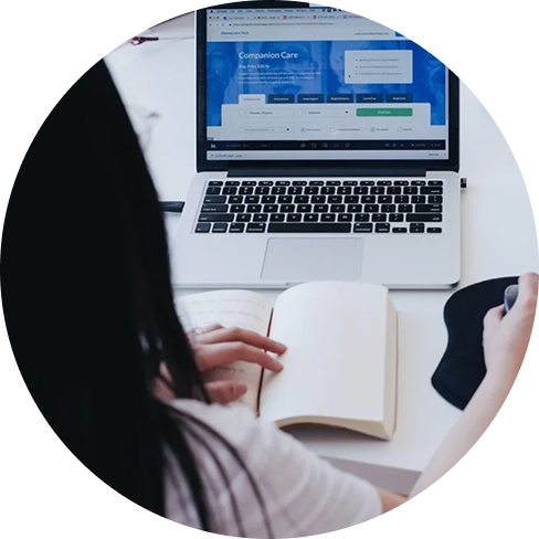 Woman sitting at a computer desk