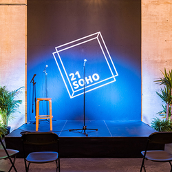 Microphone on a stage with blue spotlighting