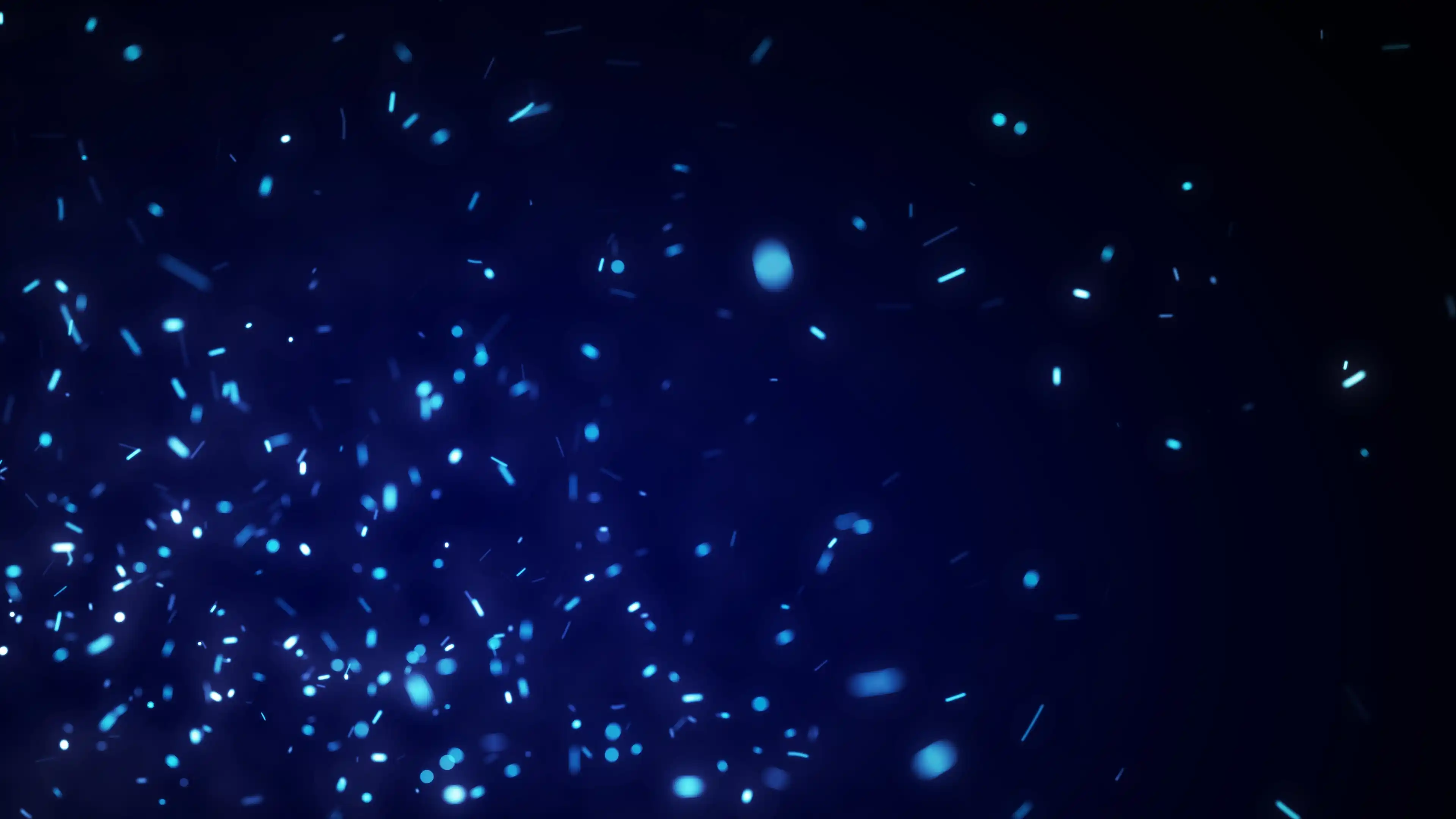 Light blue specs floating in a dark blue environment.