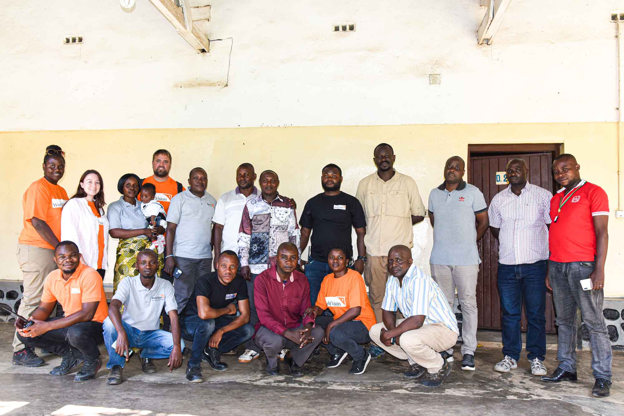 World Vision staff gather to pose for a group photo.