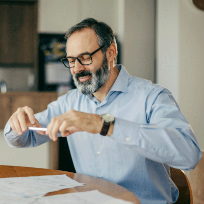 Stock photo of a bearded man taking a photo 