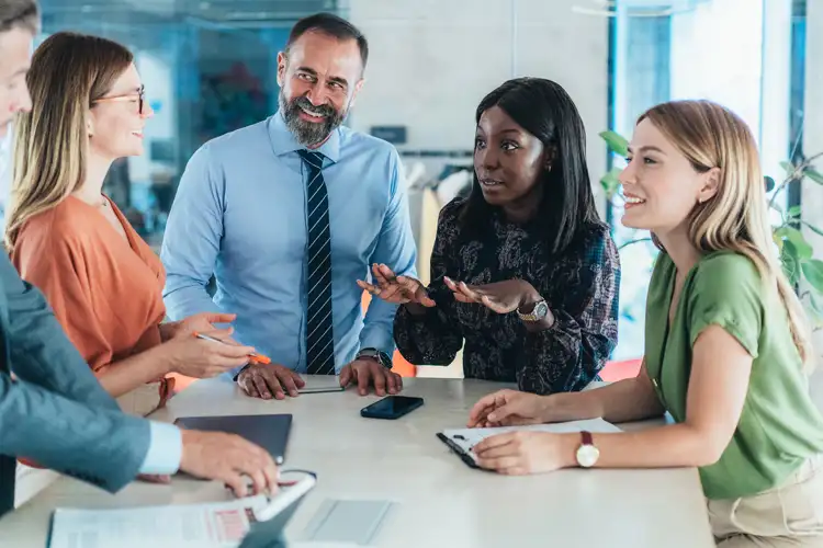 Business team meeting. Ways to Reduce Business Insurance Costs in New Jersey.