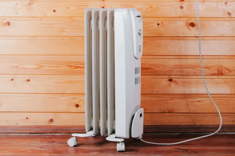 Space heater against a wooden wall. If There's an Electric Fire in Your New House, Who's Responsible?