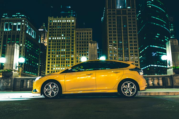 Downtown Chicago Parked Car at Night. Driving without insurance in Illinois.
