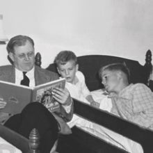 Fred Koch reading to David and Charles