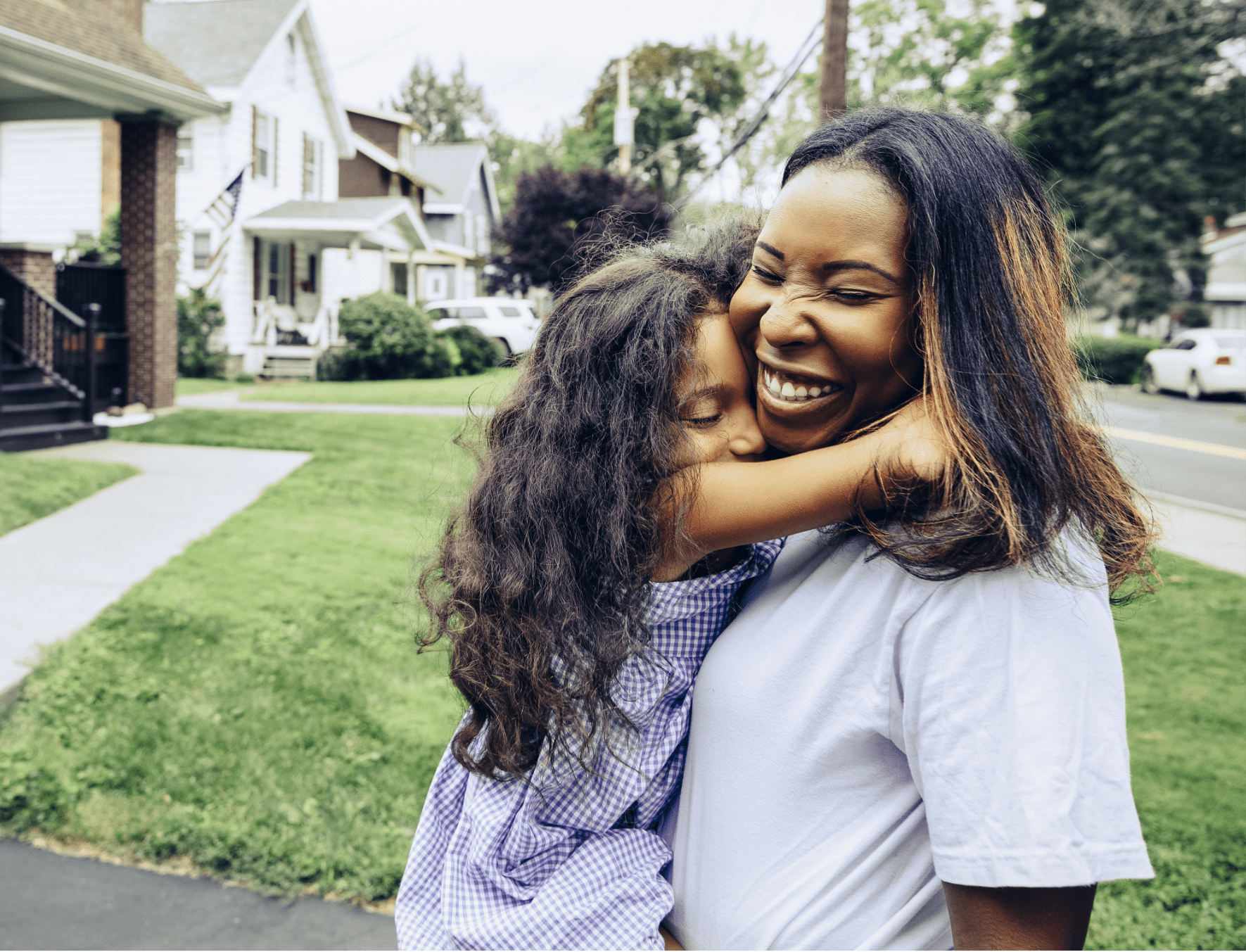 Mother holding daughter