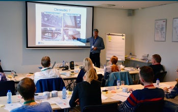 Man teaching in front of classroom