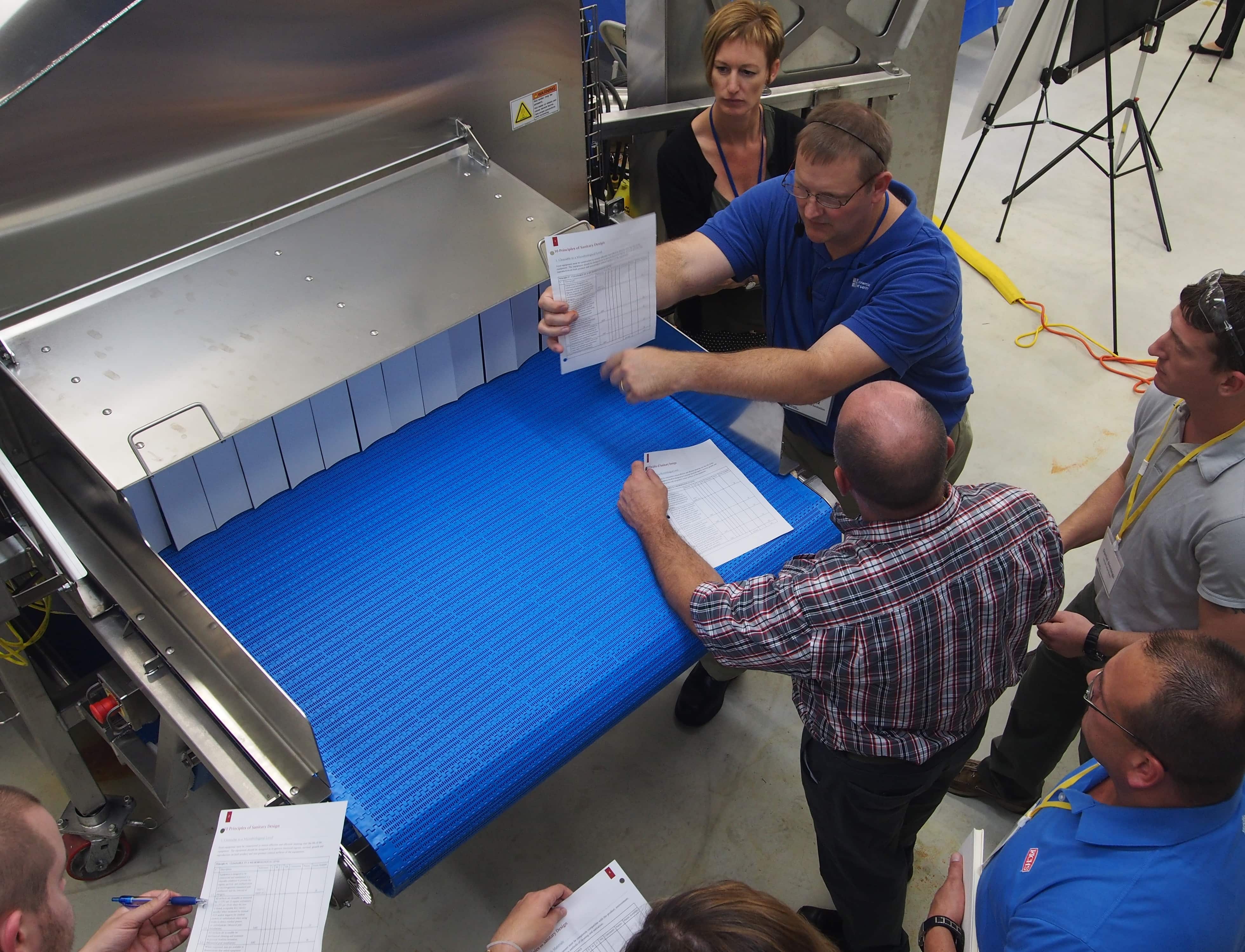 Participants reviewing equipment against design principles at CFS Hygienic Design Training