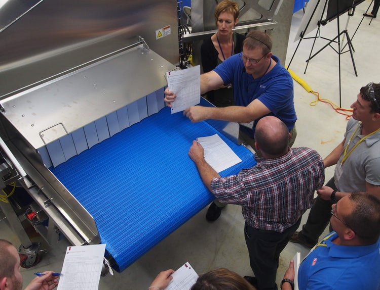 Participants reviewing equipment against design principles at CFS Hygienic Design Training