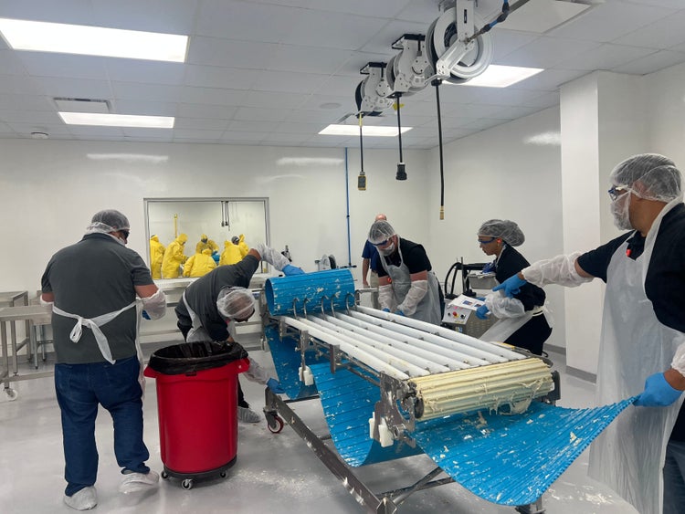 Small teams break out into hands-on cleaning practice during Sanitation Essentials Training in New Orleans