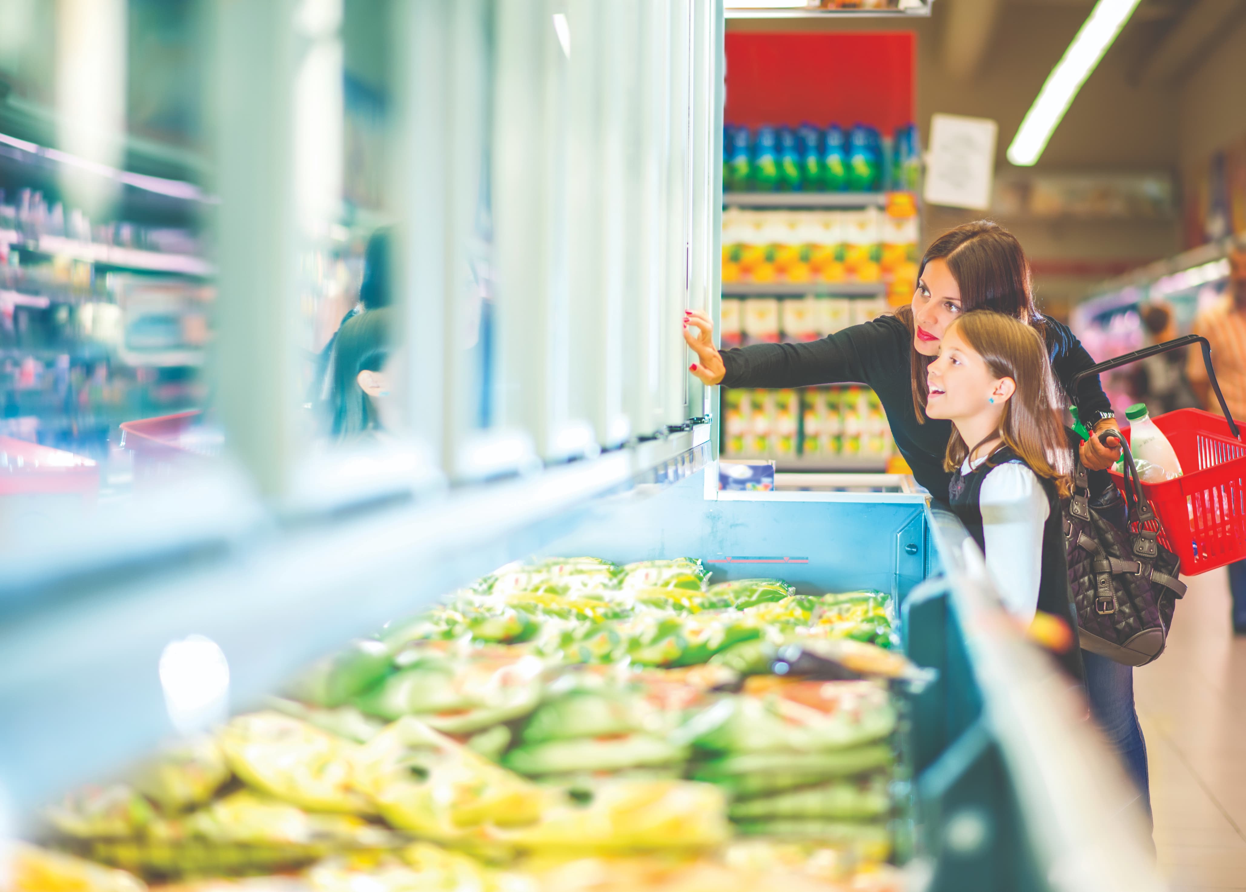 Woman and girl grocery shopping