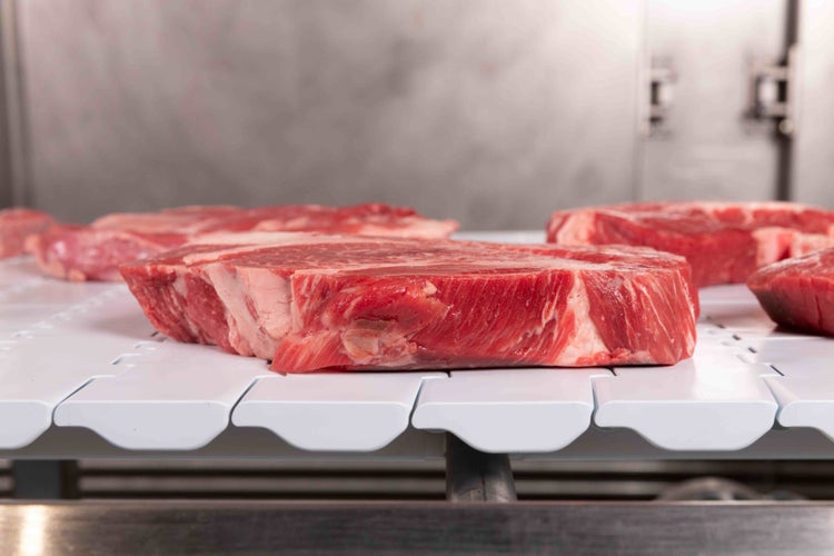 Red meat on a conveyor belt