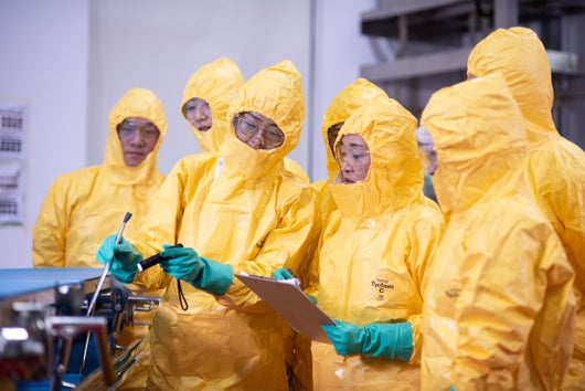 Team collaborating in PPE