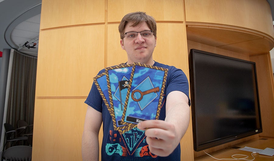 A man holding up a card