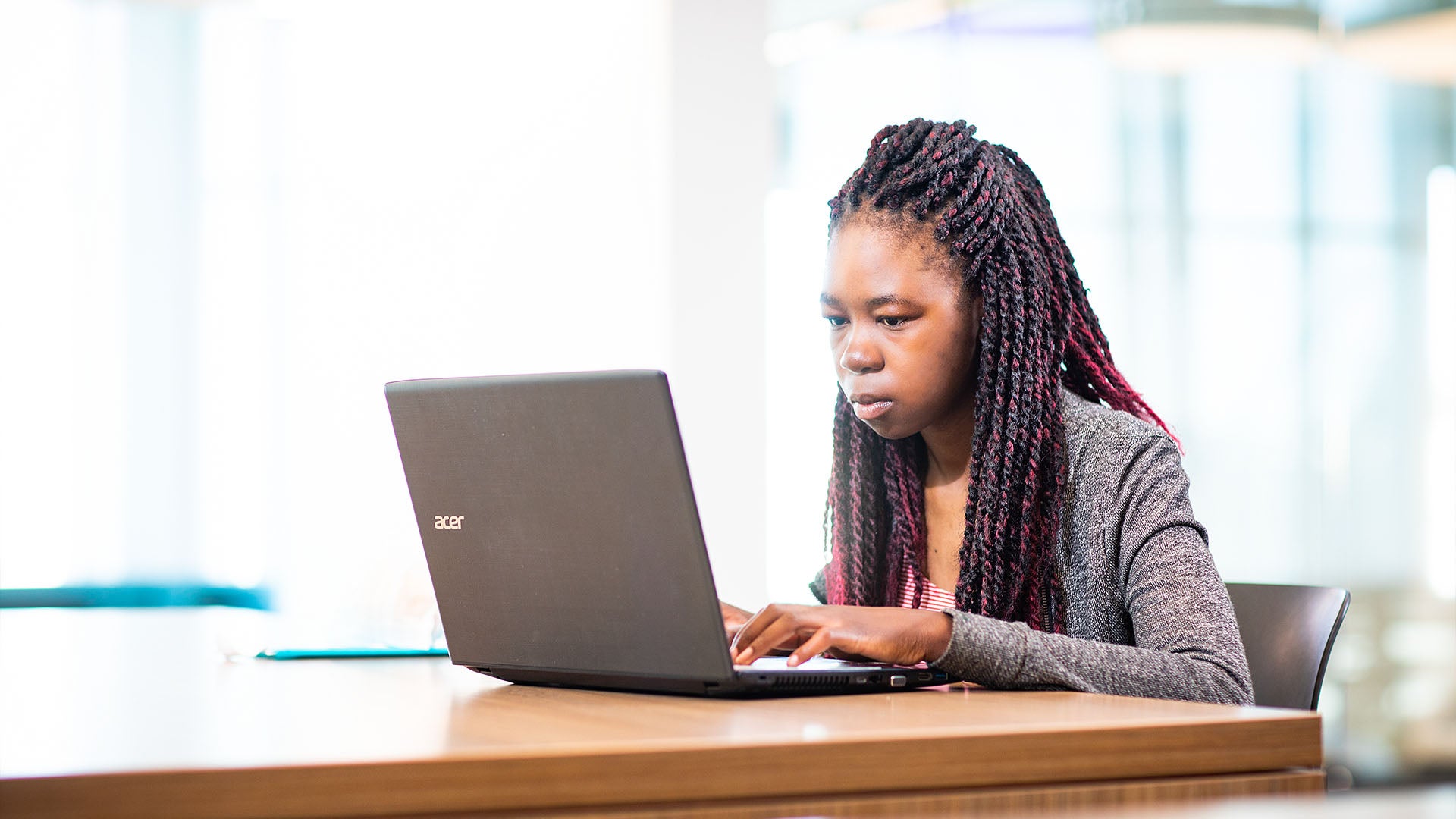 Female student using a laptop.
