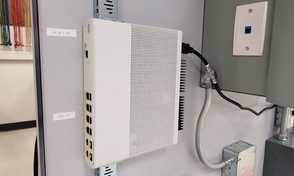 A white electronic device with many ports