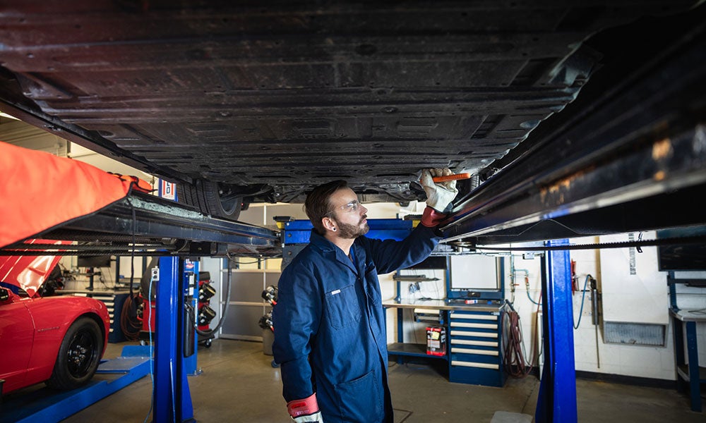 A man working under a car