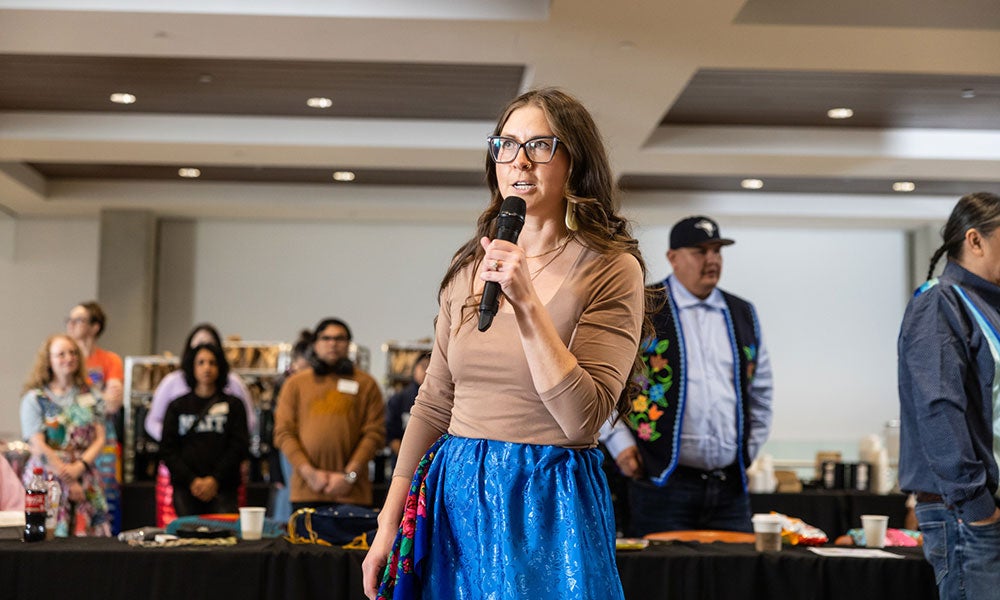 A woman holding a microphone
