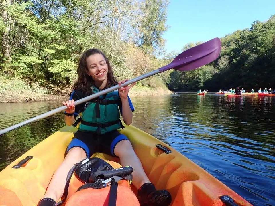 image of Lucy Morley, a young woman rowing a small boat on the water
