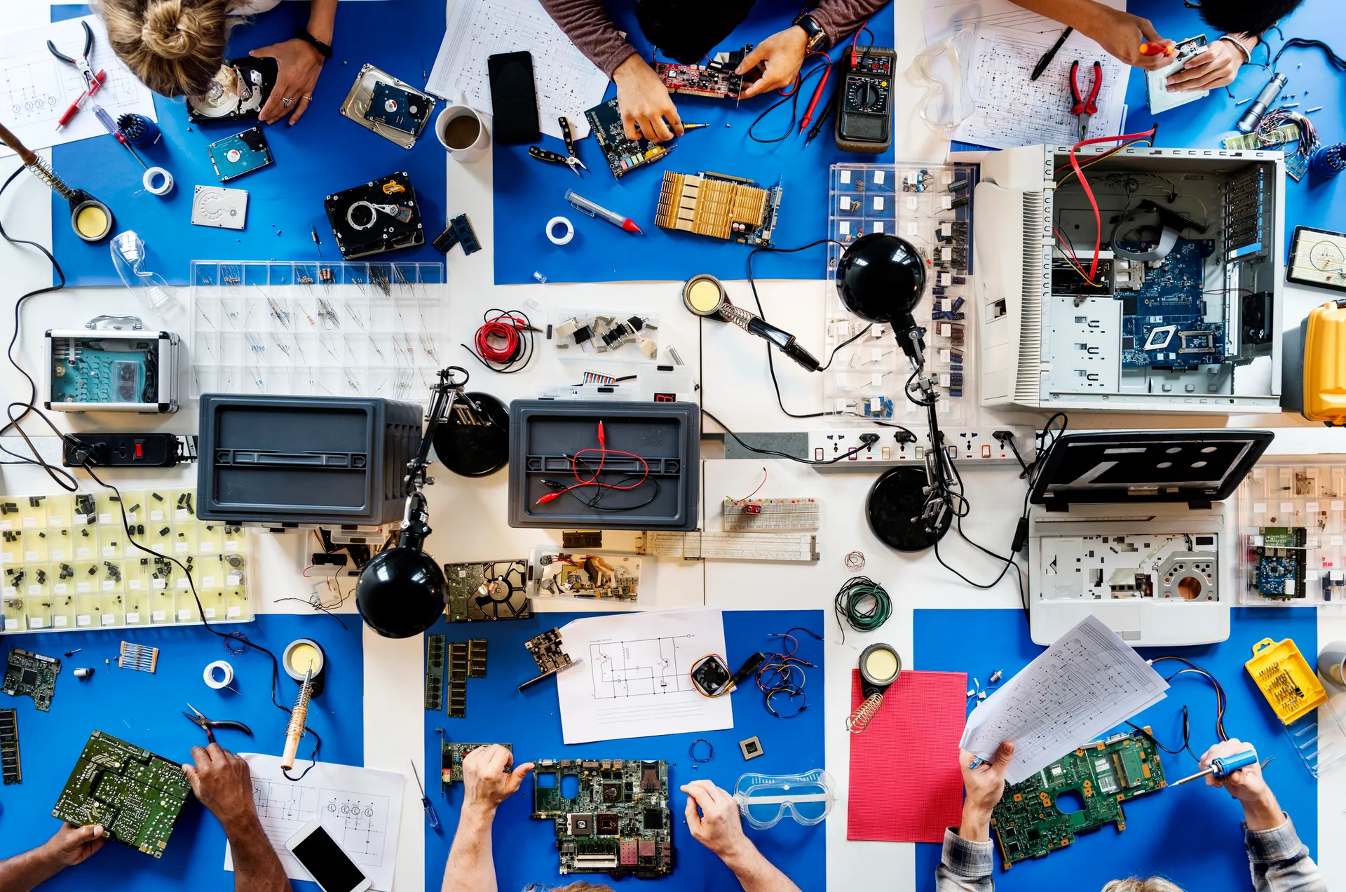 Aerial view of electronics technicians team working